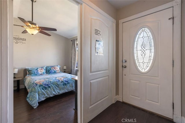 entryway with a ceiling fan and dark wood-type flooring