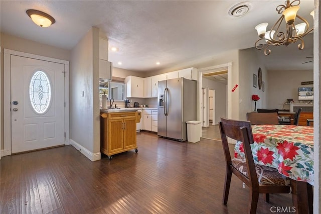 interior space featuring recessed lighting, visible vents, baseboards, a chandelier, and dark wood-style flooring
