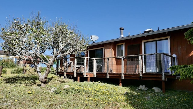 rear view of property with a deck