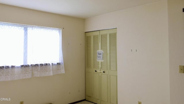 unfurnished bedroom featuring a closet