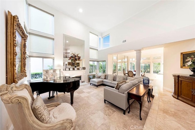 22421 Birchcrest, Mission Viejo, CA 92692 - living area with visible vents, plenty of natural light, decorative columns, and a towering ceiling