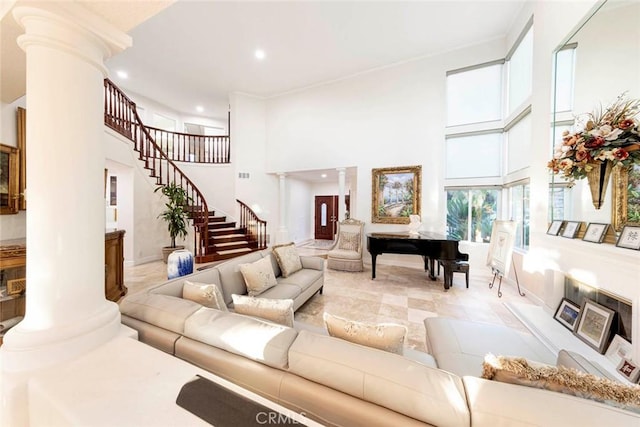 22421 Birchcrest, Mission Viejo, CA 92692 - living area featuring recessed lighting, stairway, a towering ceiling, and decorative columns