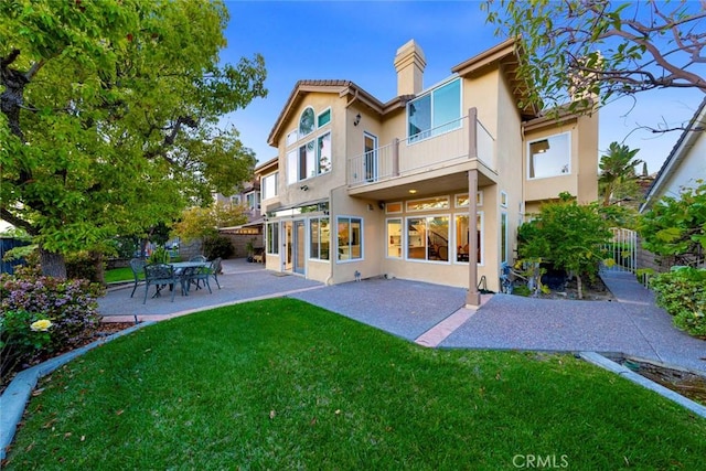 22421 Birchcrest, Mission Viejo, CA 92692 - back of house with a balcony, stucco siding, a patio, and a chimney