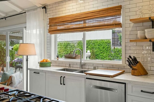 614 Crestview Dr, Ojai, CA 93023 - kitchen featuring stainless steel dishwasher, decorative backsplash, a sink, and open shelves