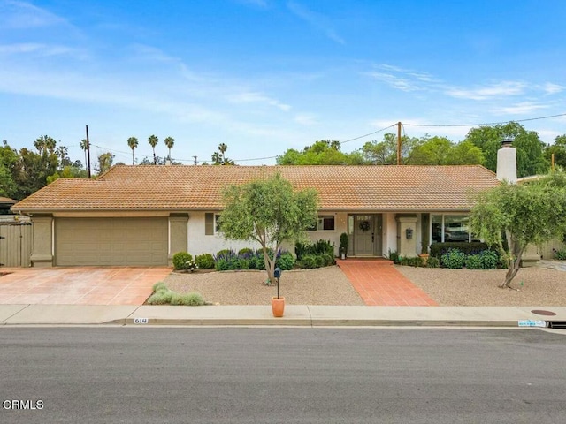 614 Crestview Dr, Ojai, CA 93023 - single story home featuring a tile roof, a garage, driveway, stucco siding, and a chimney