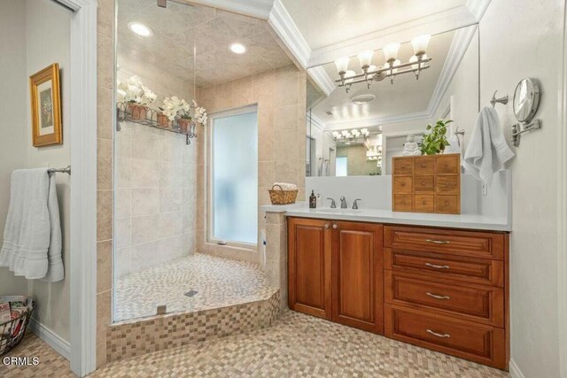 614 Crestview Dr, Ojai, CA 93023 - bathroom featuring a chandelier, a walk in shower, vanity, crown molding, and baseboards