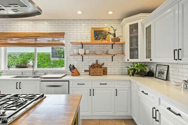 614 Crestview Dr, Ojai, CA 93023 - kitchen featuring a sink, stainless steel appliances, decorative backsplash, recessed lighting, and glass insert cabinets