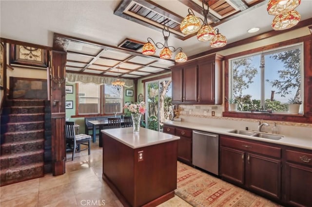 33228 Romance Pl, Temecula, CA 92592 - kitchen featuring a center island, stainless steel dishwasher, a sink, coffered ceiling, and light countertops