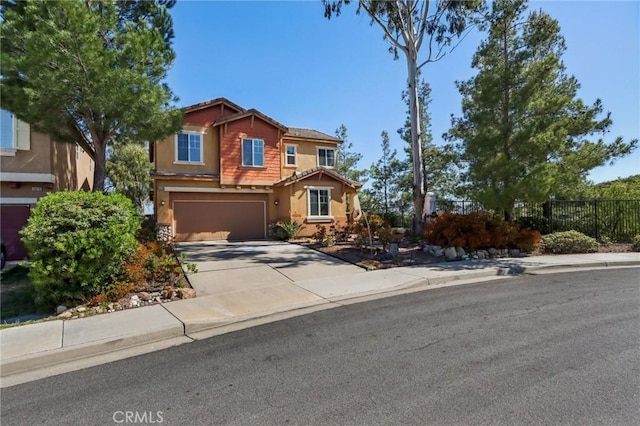 33228 Romance Pl, Temecula, CA 92592 - traditional-style home featuring driveway, an attached garage, stucco siding, and fence