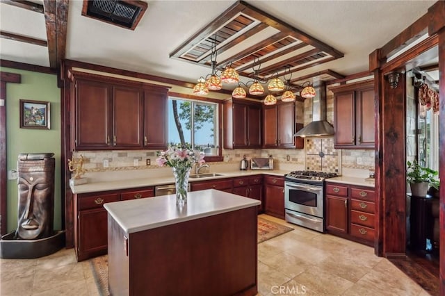 33228 Romance Pl, Temecula, CA 92592 - kitchen with light countertops, tasteful backsplash, wall chimney range hood, and appliances with stainless steel finishes