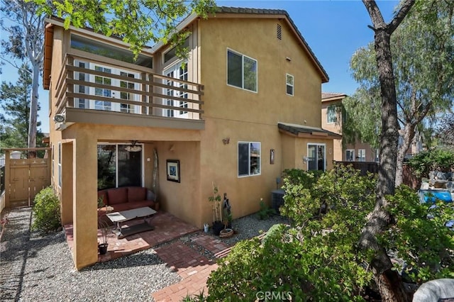 33228 Romance Pl, Temecula, CA 92592 - back of house featuring stucco siding, fence, a balcony, and a patio