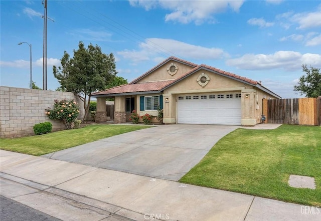 ranch-style home featuring fence, a tiled roof, a front lawn, stucco siding, and an attached garage