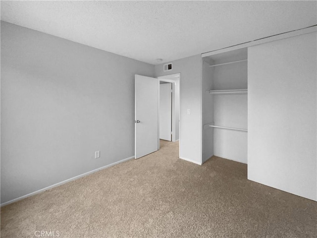 1800 E Old Ranch Rd, Colton, CA 92324 - unfurnished bedroom featuring carpet floors, a textured ceiling, and a closet