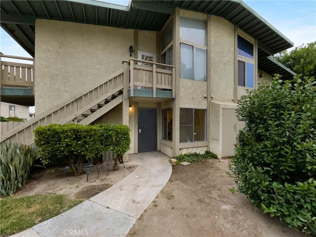 1800 E Old Ranch Rd, Colton, CA 92324 - doorway to property with stucco siding