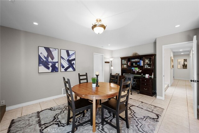 dining area featuring recessed lighting, baseboards, and light tile patterned floors