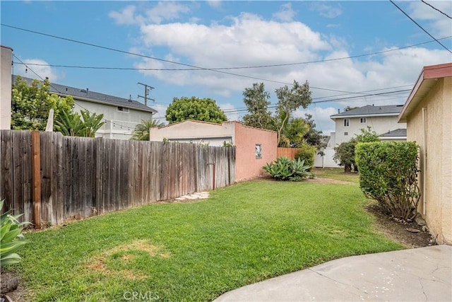 view of yard with a fenced backyard