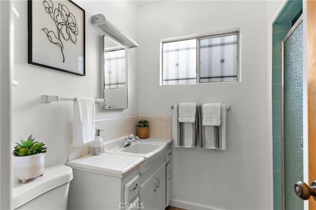 bathroom featuring toilet and vanity