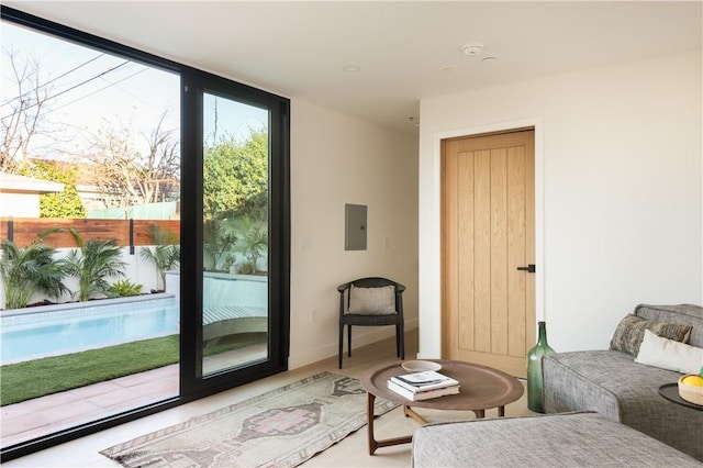 interior space featuring a wall of windows and electric panel