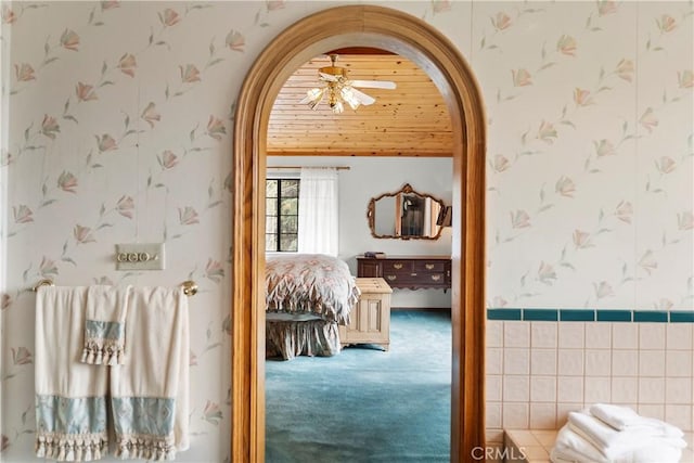 2116 Ironwood Ct, Pine Mountain Club, CA 93222 - corridor featuring wallpapered walls, arched walkways, and carpet