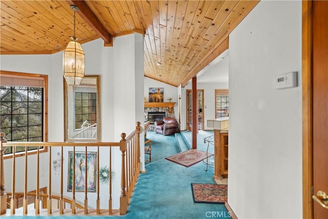 2116 Ironwood Ct, Pine Mountain Club, CA 93222 - hall featuring lofted ceiling with beams, carpet flooring, an upstairs landing, a chandelier, and wood ceiling