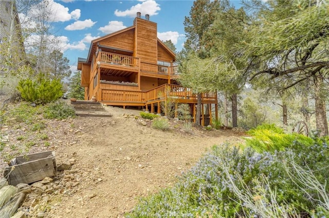 2116 Ironwood Ct, Pine Mountain Club, CA 93222 - back of house featuring a wooden deck and a chimney