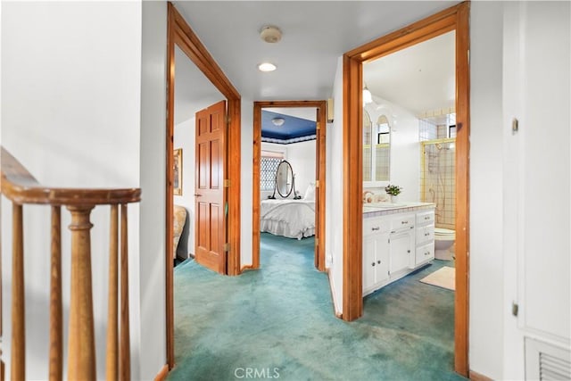 2116 Ironwood Ct, Pine Mountain Club, CA 93222 - hallway with dark colored carpet and a sink
