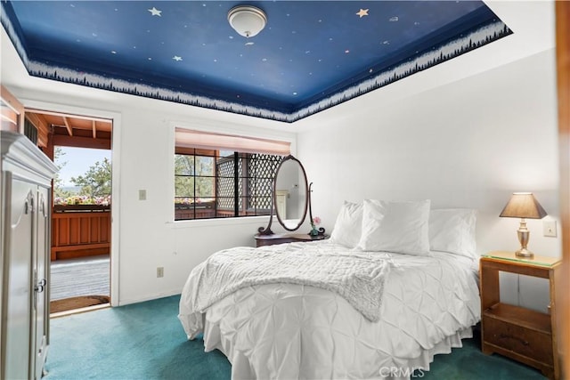 2116 Ironwood Ct, Pine Mountain Club, CA 93222 - bedroom featuring a tray ceiling, carpet floors, access to exterior, and baseboards