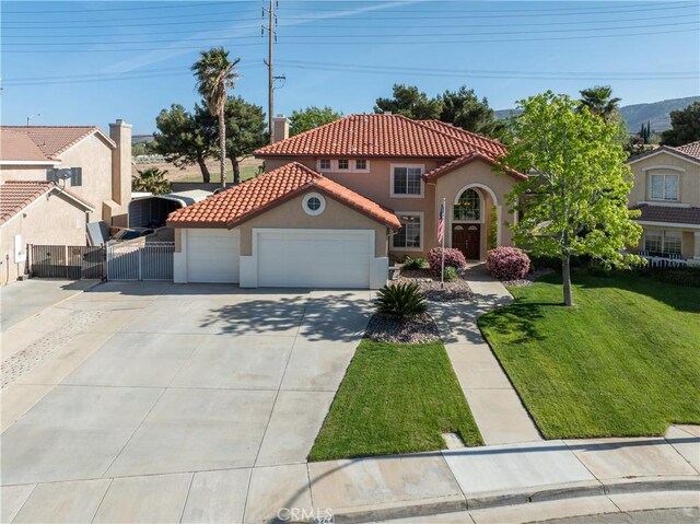 6244 Sunset Canyon Ct, Lancaster, CA 93536 - mediterranean / spanish-style house with stucco siding, a tiled roof, a garage, a gate, and driveway