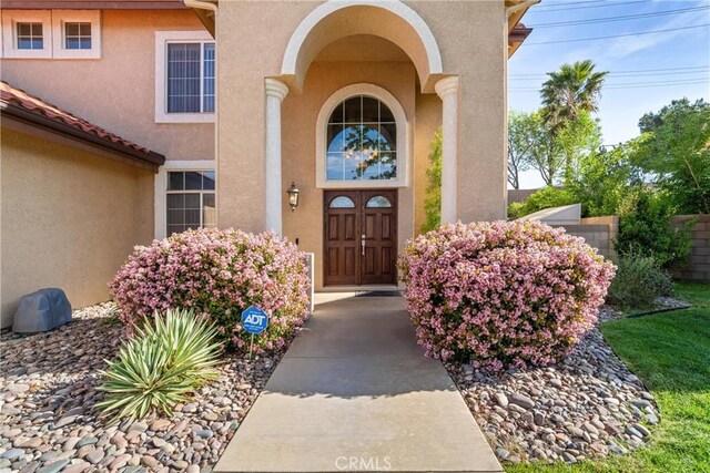 6244 Sunset Canyon Ct, Lancaster, CA 93536 - view of exterior entry with stucco siding