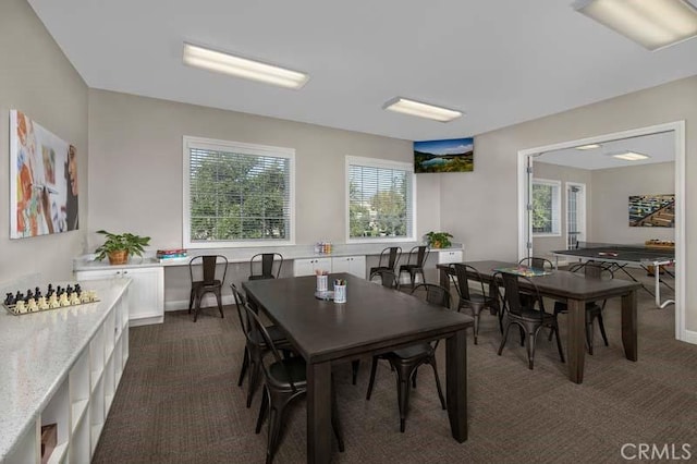 15688 Portenza Dr, Fontana, CA 92336 - dining area with dark carpet and baseboards