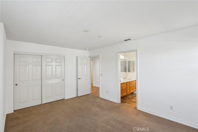 15688 Portenza Dr, Fontana, CA 92336 - unfurnished bedroom featuring carpet, baseboards, a closet, a sink, and ensuite bathroom