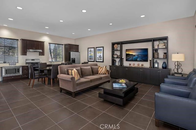 15688 Portenza Dr, Fontana, CA 92336 - living area with dark tile patterned floors and recessed lighting