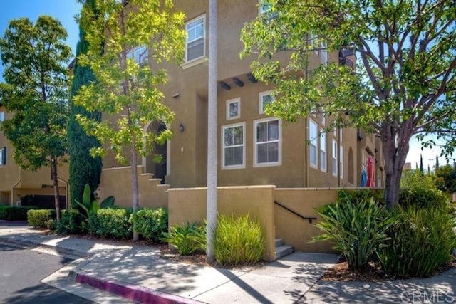 view of side of property featuring stucco siding