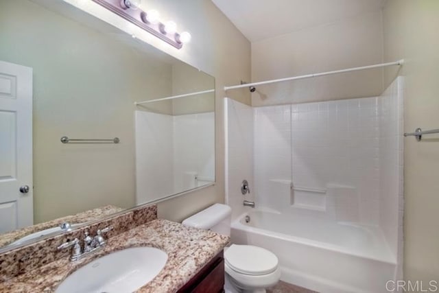 bathroom featuring shower / bathing tub combination, toilet, and vanity