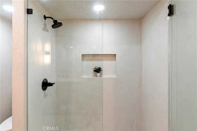 full bath with toilet and walk in shower