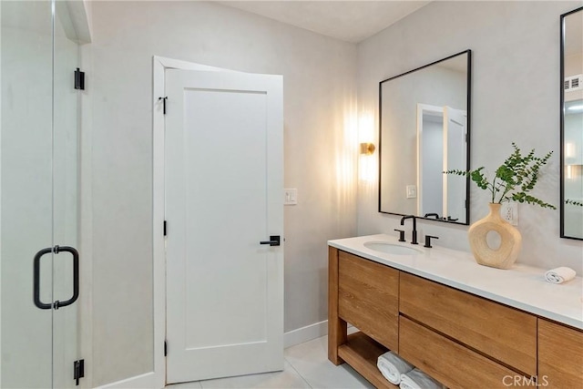bathroom featuring tile patterned flooring and vanity