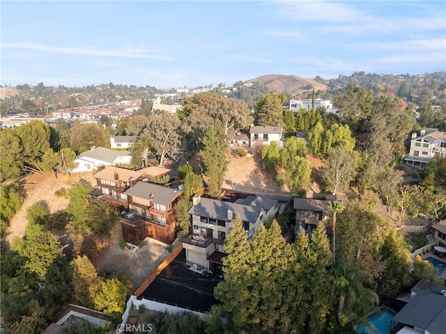 drone / aerial view featuring a residential view and a mountain view
