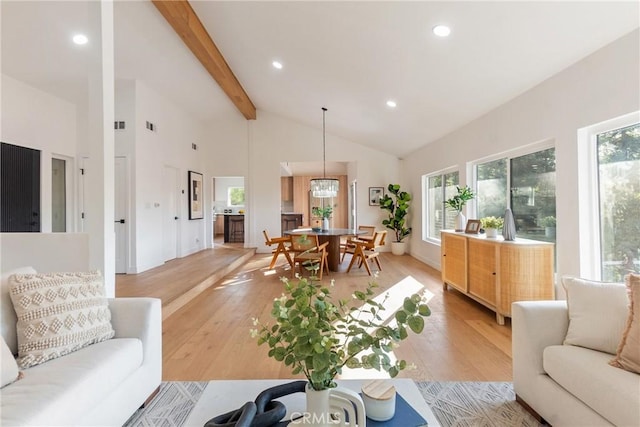 living room with light wood-type flooring, recessed lighting, beamed ceiling, and high vaulted ceiling