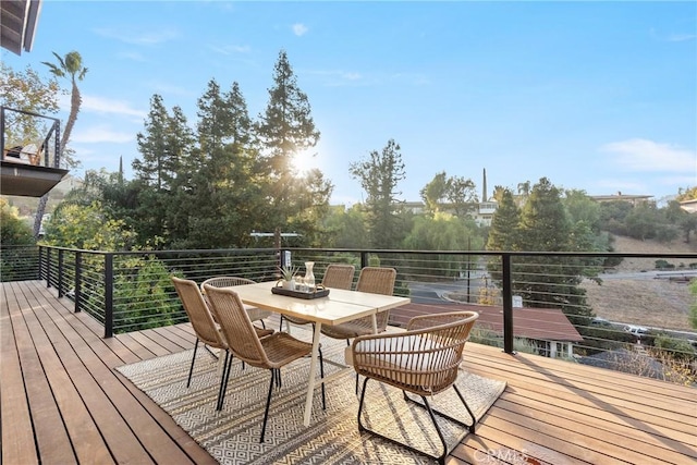 deck with outdoor dining area