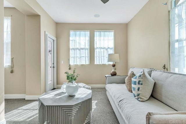 10495 Abalone Lndg, San Diego, CA 92130 - carpeted living room with baseboards, healthy amount of natural light, and ceiling fan