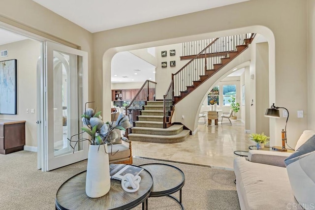 10495 Abalone Lndg, San Diego, CA 92130 - entrance foyer with arched walkways, stairs, and baseboards