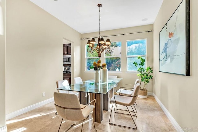 10495 Abalone Lndg, San Diego, CA 92130 - dining room featuring a chandelier, baseboards, and light tile patterned floors