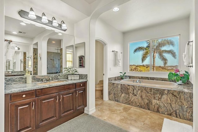 10495 Abalone Lndg, San Diego, CA 92130 - bathroom featuring a stall shower, a garden tub, toilet, vanity, and recessed lighting