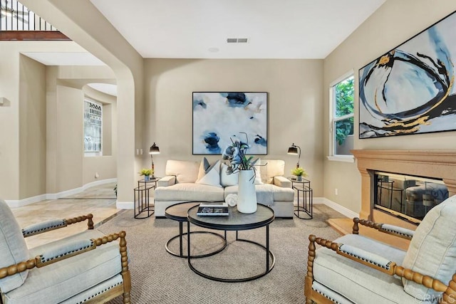 10495 Abalone Lndg, San Diego, CA 92130 - living area with baseboards and a glass covered fireplace