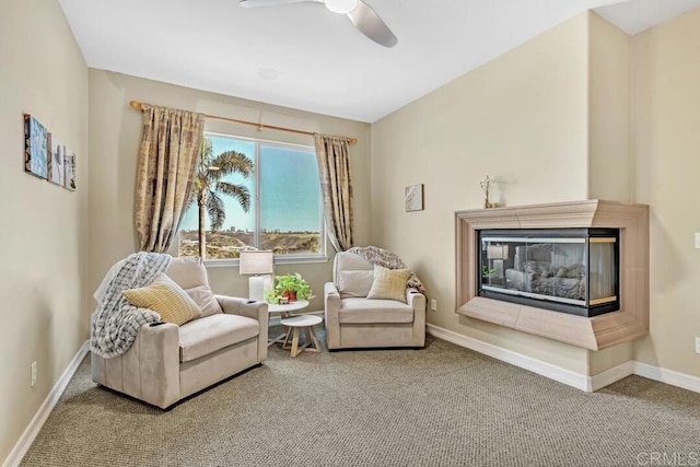 10495 Abalone Lndg, San Diego, CA 92130 - living area featuring carpet flooring, a ceiling fan, baseboards, and a multi sided fireplace