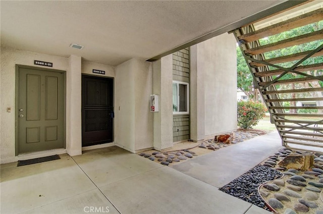 8566 Van Ness Ct Unit 21D, Huntington Beach, CA 92646 - property entrance featuring stucco siding