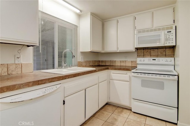 8566 Van Ness Ct Unit 21D, Huntington Beach, CA 92646 - kitchen with white appliances, a sink, white cabinets, and backsplash