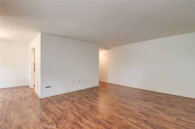 8566 Van Ness Ct Unit 21D, Huntington Beach, CA 92646 - spare room with wood finished floors and baseboards