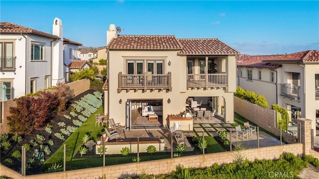 116 Via Bilbao, San Clemente, CA 92672 - rear view of house with a balcony, a tile roof, stucco siding, a patio, and a fenced backyard
