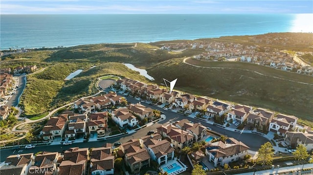 aerial view with a water view and a residential view